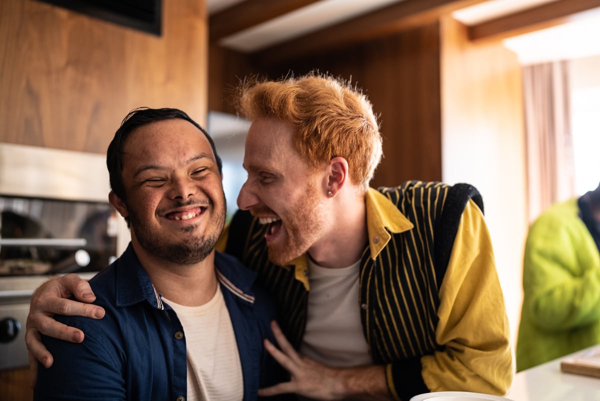 Man with Down Syndrome Laughing with Friend